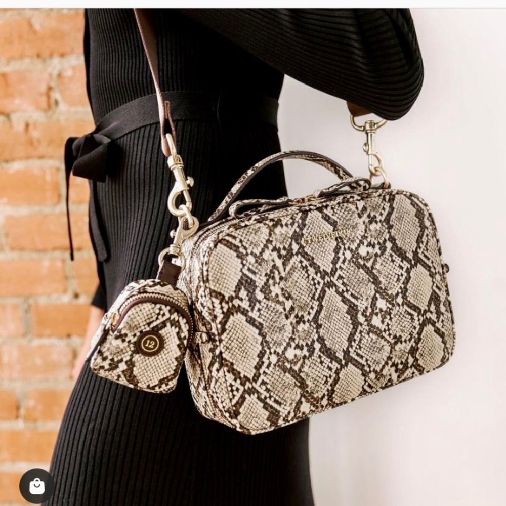 Twelve Little Diaper Clutch in snake print with paci holder pouch.